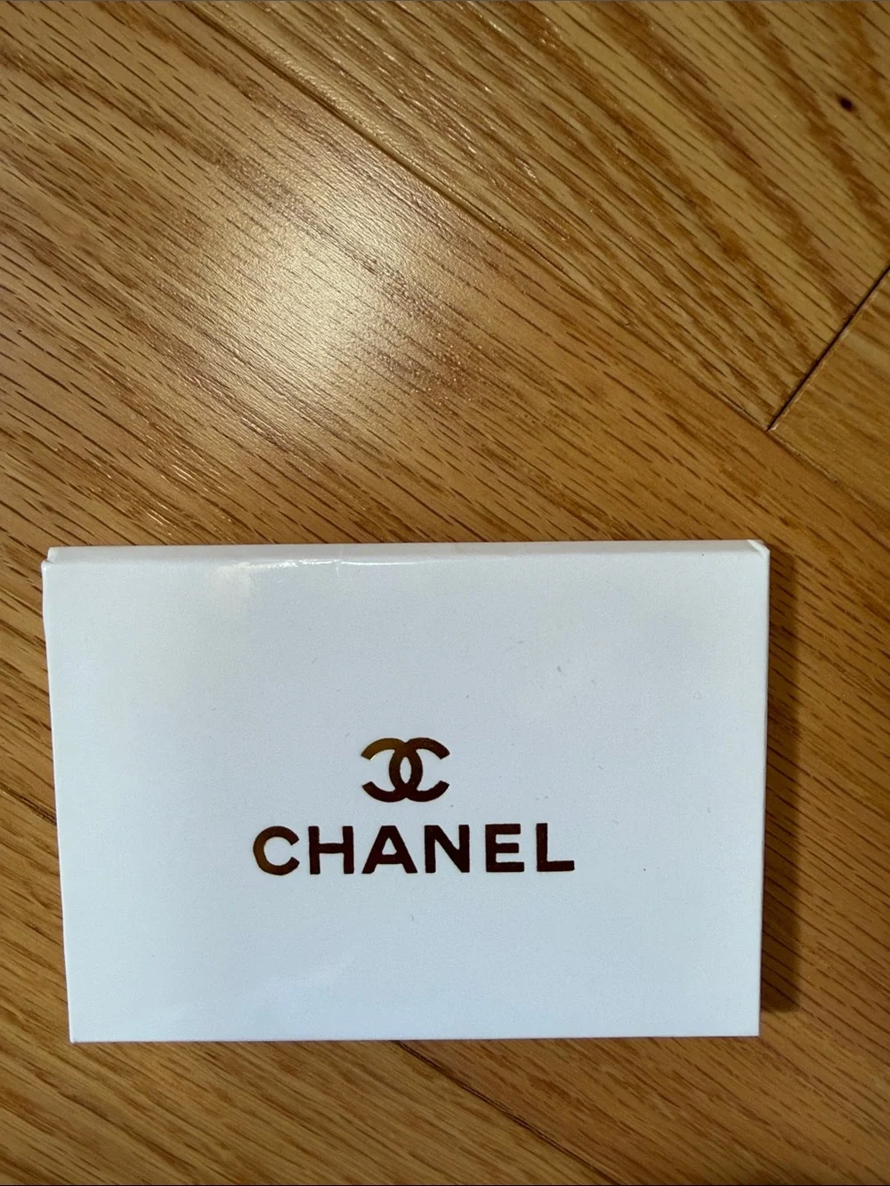 Chanel black card case with mirror.